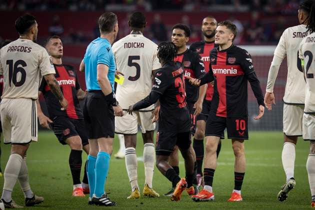 UEFA Europa League semi-final Bayer 04 Leverkusen vs AS Roma, 09 05 2024 Referee Danny Makkelie Netherlands shows the yellow card to Florian Wirtz Bayer 04 Leverkusen, 10 during the Europa League semi-final between Bayer 04 Leverkusen and AS Roma at BayArena on 09 05 2024 in Leverkusen, Germany DFL REGULATIONS PROHIBIT ANY USE OF PHOTOGRAPHS AS IMAGE SEQUENCES AND OR QUASI VIDEO Copyright: xBEAUTIFULxSPORTS AxelxKohringx