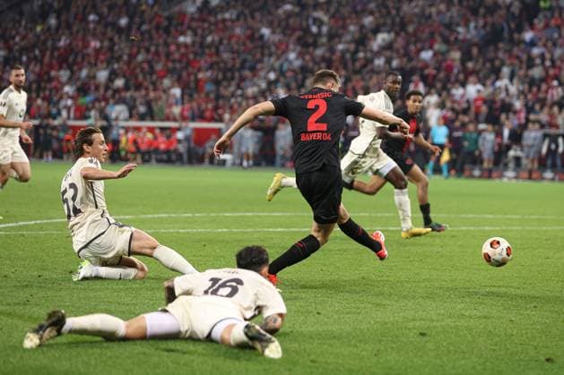 Josip Stanisic of Bayer Leverkusen scores to make it 2-2 Bayer 04 Leverkusen v Roma, UEFA Europa League, Semi Final, Second Leg Football, BayArena, Leverkusen, Germany - 09 May 2024 EDITORIAL USE ONLY No use with unauthorised audio, video, data, fixture lists, club league logos or live services. Online in-match use limited to 120 images, no video emulation. No use in betting, games or single club league player publications. Copyright: xPaulxCurrie Shutterstockx 14470736bf