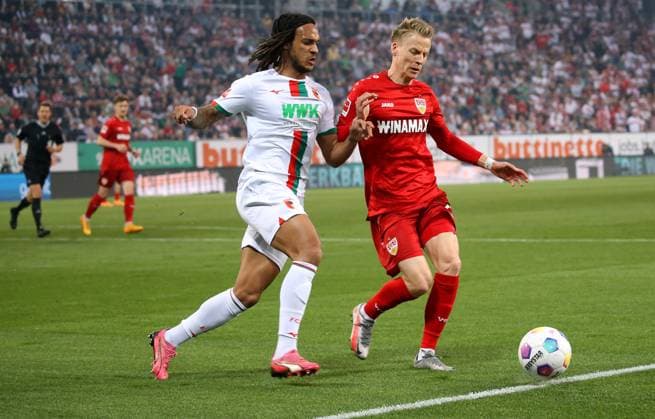 Augsburg , Bundesliga FC Augsburg vs VfB Stuttgart, f l Kevin Mbabu Augsburg , Chris Führich VfB In accordance with the regulations of the DFL German Football League, it is prohibited to exploit or have exploited photographs taken in the stadium and or of the match in the form of sequential images and or video-like photo series