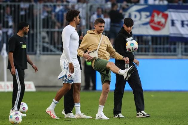 Goalkeeper Julian Pollersbeck M ,1 FC Magdeburg,42 and Jamie Lawrence 1 FC Magdeburg,5 2 Soccer Bundesliga Season 2023 2024 1 FC Magdeburg vs SpVgg Greuther Fürth at the MDCC Arena in Magdeburg Soccer,Man,Men,Germany,10 05 2024
