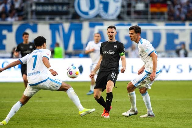 Branimir Hrgota SpVgg Greuther Fürth,10 vs Tobias Müller 1 FC Magdeburg,21 and Herbert Bockhorn 1 FC Magdeburg,7 2 Soccer Bundesliga Season 2023 2024 1 FC Magdeburg vs SpVgg Greuther Fürth at the MDCC Arena in Magdeburg Action,Soccer,Man,Men,Germany,10 05 2024