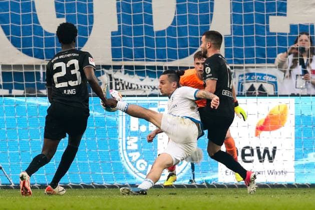 Baris Atik 1 FC Magdeburg,23 vs Niko Gießelmann SpVgg Greuther Fürth,17 and Gideon Jung SpVgg Greuther Fürth,23 2 Soccer Bundesliga Season 2023 2024 1 FC Magdeburg vs SpVgg Greuther Fürth at the MDCC Arena in Magdeburg Action,Soccer,Man,Men,Germany,10 05 2024