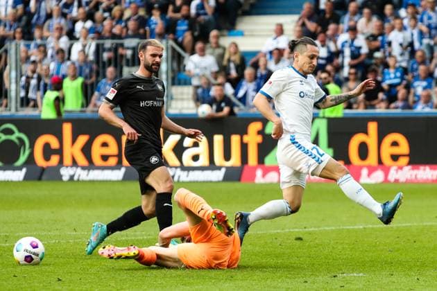 Baris Atik 1 FC Magdeburg,23 vs Goalkeeper Jonas Urbig SpVgg Greuther Fürth,40 and Simon Asta SpVgg Greuther Fürth,2 2 Soccer Bundesliga Season 2023 2024 1 FC Magdeburg vs SpVgg Greuther Fürth at the MDCC Arena in Magdeburg Action,Soccer,Man,Men,Germany,10 05 2024
