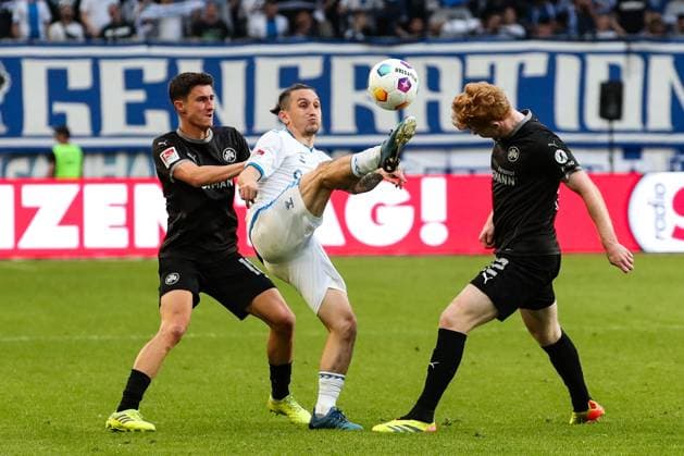 Baris Atik 1 FC Magdeburg,23 vs Robert Wagner r ,SpVgg Greuther Fürth,22 and Marco Meyerhöfer SpVgg Greuther Fürth,18 2 Soccer Bundesliga Season 2023 2024 1 FC Magdeburg vs SpVgg Greuther Fürth at the MDCC Arena in Magdeburg Action,Soccer,Man,Men,Germany,10 05 2024