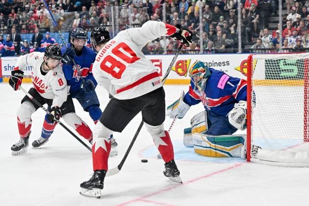 PRAGUE, CZECH REPUBLIC MAY 11 Michael Bunting of Canada L battles for the puck against Evan Mosey of Great Britain and goalkeeper Jackson Whistle of Great Britain during the preliminary round match between Great Britain and Canada at Prague Arena on May 11, 2024 in Prague Prague, Czech Republic Prague Prague Arena Czech Republic Copyright: xJustPictures.ch AndreaxBrancax jp-en-EuSpIm-AB_11052024_AAB_4205