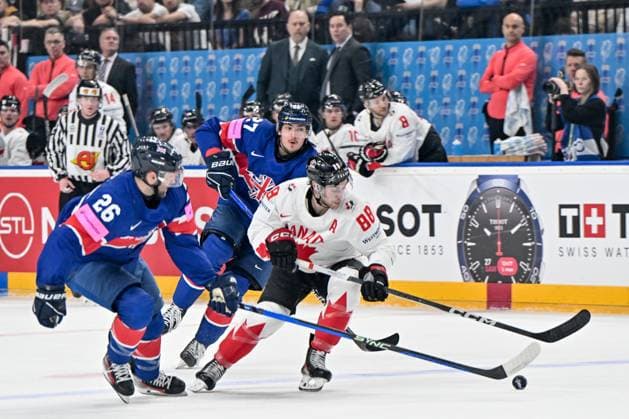 PRAGUE, CZECH REPUBLIC MAY 11 Andrew Mangiapane of Canada protects the puck against Evan Mosey of Great Britain during the preliminary round match between Great Britain and Canada at Prague Arena on May 11, 2024 in Prague, Czech Republic Prague Prague Arena Czech Republic Copyright: xJustPictures.ch AndreaxBrancax jp-en-EuSpIm-AB_11052024_AAB_4584