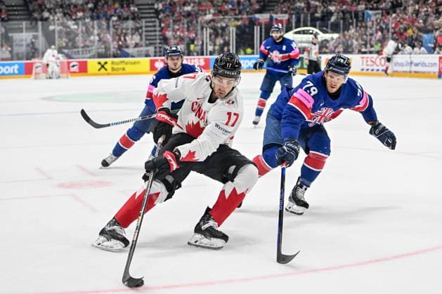 PRAGUE, CZECH REPUBLIC MAY 11 Jack Mcbain of Canada protects the puck against Nathanael Halbert of Great Britain during the preliminary round match between Great Britain and Canada at Prague Arena on May 11, 2024 in Prague, Czech Republic Prague Prague Arena Czech Republic Copyright: xJustPictures.ch AndreaxBrancax jp-en-EuSpIm-AB_11052024_AAB_4745