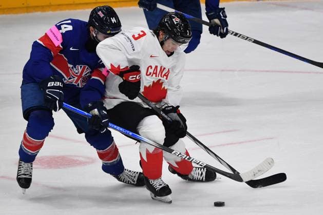 May 11, 2024, Prague, Czech Republic: OLEN ZELLWEGER of Canada (3) and LIAM KIRK of Great Britain (14) during the 2024 IIHF Ice hockey, Eishockey World Championship, WM, Weltmeisterschaft match between Great Britain and Canada at the O2 arena in Prag, Czech Republic, May 11, 2024. Prague Czech Republic - ZUMAr156 20240511_aap_r156_018 Copyright: xSlavekxRutax