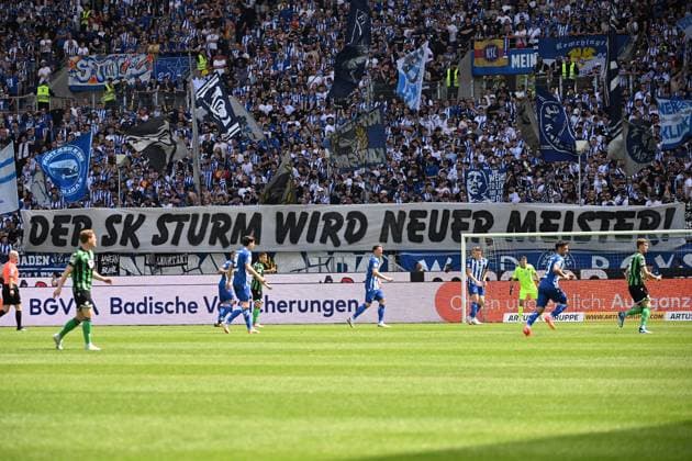 12 05 2024, xjhx, Soccer 2 Bundesliga, Karlsruher SC Hannover 96 emspor, v l Fans Spectators Ultras Visitors Mood Scarves Jerseys Karlsruher SC Sturm Graz Banner Poster Sign DFL DFB REGULATIONS PROHIBIT ANY USE OF PHOTOGRAPHS as IMAGE SEQUENCES and or QUASI VIDEO Karlsruhe