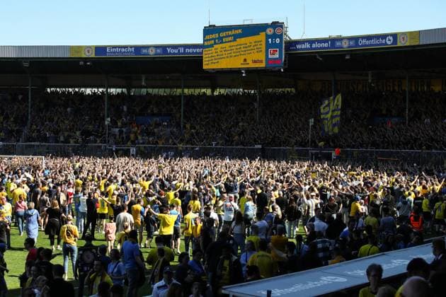 Eintracht Braunschweig fans storm the pitch after the match 2 Soccer Bundesliga season 2023 2024 Eintracht Braunschweig vs SV Wehen Wiesbaden at Eintracht Stadium in Braunschweig Soccer,Man,Men,Germany,12 05 2024