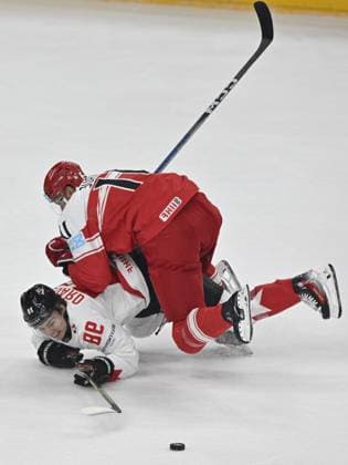 Denmark vs Canada group A match of the 2024 IIHF World Championship, WM, Weltmeisterschaft in Prague, Czech Republic, on May 12, 2024. Alexander True of Denmark and Connor Bedard (down) of Canada. (CTKxPhoto VitxSimanek) CTKPhotoP2024051204351  CTKPhotoP2024051204351