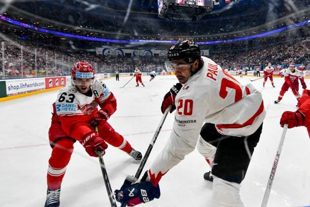 PRAGUE, CZECH REPUBLIC MAY 12 Nick Paul of Canada battles for the puck against Patrick Russell of Denmark during the preliminary round match between Denmark and Canada at Prague Arena on May 12, 2024 in Prague, Czech Republic Prague Prague Arena Czech Republic Copyright: xJustPictures.ch AndreaxBrancax jp-en-EuSpIm-AB_12052024_DSC_8943