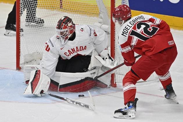 Denmark vs Canada group A match of the 2024 IIHF World Championship, WM, Weltmeisterschaft in Prague, Czech Republic, on May 12, 2024. From left Jordan Binnington goalie of Canada, Oscar Fisker Moelgaard of Denmark. (CTKxPhoto VitxSimanek) CTKPhotoP2024051204826  CTKPhotoP2024051204826