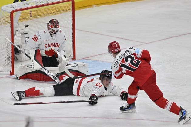 Denmark vs Canada group A match of the 2024 IIHF World Championship, WM, Weltmeisterschaft in Prague, Czech Republic, on May 12, 2024. From left Jordan Binnington of Canada, Kaiden Guhle of Canada, Oscar Fisker Moelgaard of Denmark. (CTKxPhoto VitxSimanek) CTKPhotoP2024051205169  CTKPhotoP2024051205169