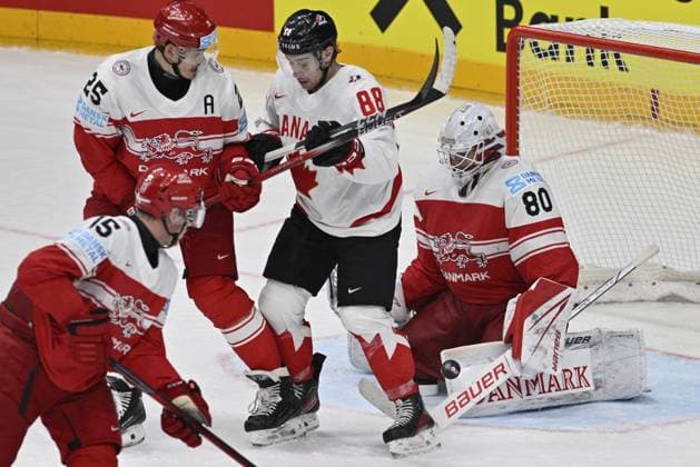 Denmark vs Canada group A match of the 2024 IIHF World Championship, WM, Weltmeisterschaft in Prague, Czech Republic, on May 12, 2024. From left Matias Lassen of Denmark, Oliver Lauridsen of Denmark, Andrew Mangiapane of Canada, Frederik Dichow goalie of Denmark. (CTKxPhoto VitxSimanek) CTKPhotoP2024051205289  CTKPhotoP2024051205289