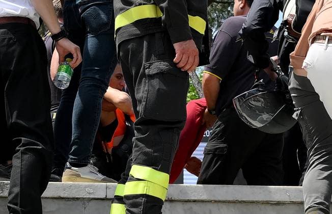 May 13, 2024, Rome, Italy: Ambientalisti di Fondo Riparazione circondati dalla polizia mentre vengono allontanati dal campo Pietrangeli, dove era in corso la partita tra Keys e Cirstea agli Internazionali di tennis, al Foro Italico, che e stata interrotta dalla loro azione di protesta, Roma, 13 maggio 2024. ANSA ETTORE FERRARI Environmentalists, of Fondo Riparazione (Repairing Fund) movement, being taken away from Pietrangeli field by the police after their protest with which they interrupted the match between Keys and Cirstea at the Italian Open tennis tournament, at the Foro Italico, Rome, Italy, 13 May 2024. ANSA ETTORE FERRARI Internazionali: vernice sul campo da ambientalisti, stop a match  - ZUMAa110 20240513_zaf_a110_010 Copyright: xEttorexFerrarix