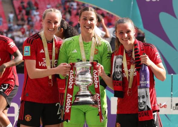 London, England, 12th May 2024. (L-R) Millie Turner, Mary Earps and Ella Toone of Manchester United, ManU celebrate with the trophy after winning the The Women s FA Cup match at Wembley Stadium, London. Picture credit should read: Paul Terry Sportimage EDITORIAL USE ONLY. No use with unauthorised audio, video, data, fixture lists, club league logos or live services. Online in-match use limited to 120 images, no video emulation. No use in betting, games or single club league player publications. SPI-3143-0076
