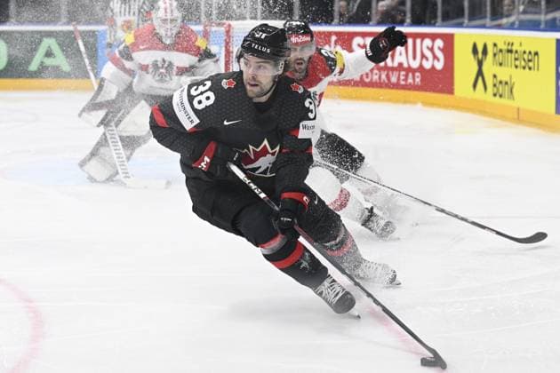 L-R goalkeeper David Madlener (AUT), Brandon Hagel (CAN) and Steven Strong (AUT) in action during the 2024 IIHF World Championship, WM, Weltmeisterschaft group A, match Canada vs Austria, in Prague, Czech Republic, on May 14, 2024. (CTKxPhoto MichalxKamaryt) CTKPhotoP2024051409126  CTKPhotoP2024051409126