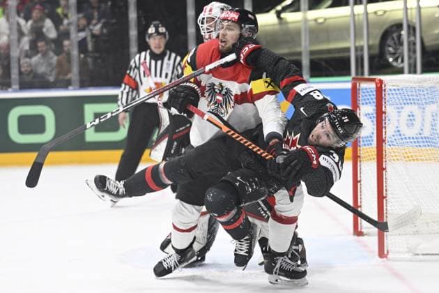 L-R Paul Stapelfeldt (AUT) and Brandon Hagel (CAN) in action during the 2024 IIHF World Championship, WM, Weltmeisterschaft group A, match Canada vs Austria, in Prague, Czech Republic, on May 14, 2024. (CTKxPhoto MichalxKamaryt) CTKPhotoP2024051409420  CTKPhotoP2024051409420