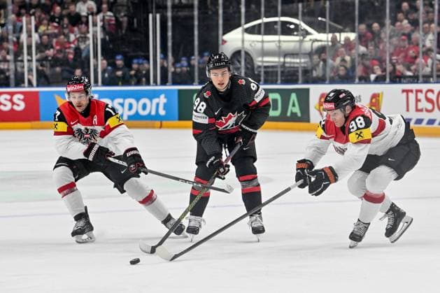 PRAGUE, CZECH REPUBLIC MAY 14 Connor Bedard of Canada chases the puck with Manuel Ganahl of Austria L and Benjamin Baumgartner of Austria R during the preliminary round match between Canada and Austria at Prague Arena on May 14, 2024 in Prague, Czech Republic Prague Czech Republic Copyright: xJustPictures.ch AndreaxBrancax jp-en-EuSpIm-AB_14052024_AAB_8509