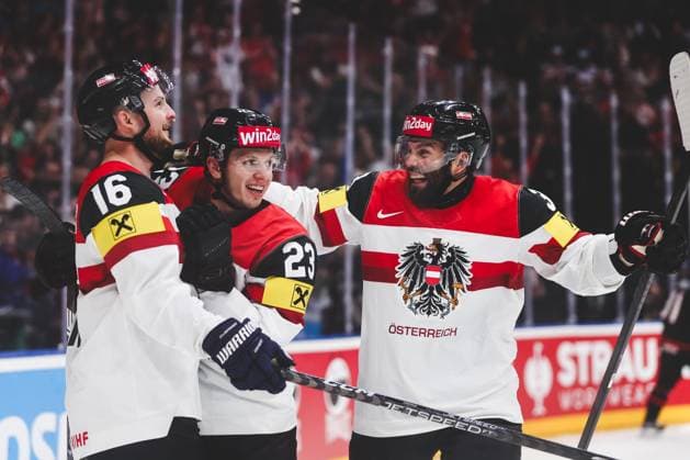 Ice hockey, Eishockey - IIHF WC 2024 PRAGUE,CZECH REPUBLIC,14.MAY.24 - ICE HOCKEY - IIHF Ice Hockey World Championship, WM, Weltmeisterschaft 2024, group stage, Austria vs Canada. Image shows the rejoicing of Dominic Zwerger, Marco Rossi and Peter Schneider (AUT).  GEPAxpictures xDanielxGoetzhaber