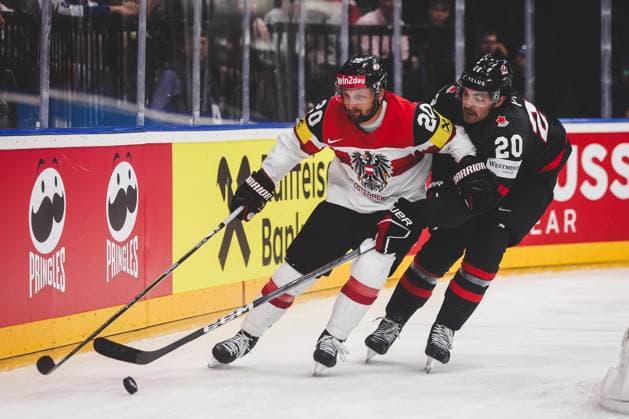 Ice hockey, Eishockey - IIHF WC 2024 PRAGUE,CZECH REPUBLIC,14.MAY.24 - ICE HOCKEY - IIHF Ice Hockey World Championship, WM, Weltmeisterschaft 2024, group stage, Austria vs Canada. Image shows Nico Brunner (AUT) and Nick Paul (CAN).  GEPAxpictures xDanielxGoetzhaber