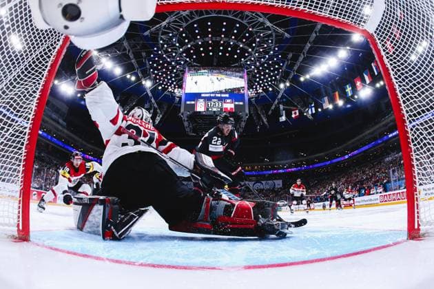 Ice hockey, Eishockey - IIHF WC 2024 PRAGUE,CZECH REPUBLIC,14.MAY.24 - ICE HOCKEY - IIHF Ice Hockey World Championship, WM, Weltmeisterschaft 2024, group stage, Austria vs Canada. Image shows David Madlener (AUT) and Dylan Cozens (CAN). Keywords: netcam.  GEPAxpictures xDanielxGoetzhaber