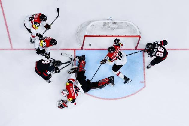 Ice hockey, Eishockey - IIHF WC 2024 PRAGUE,CZECH REPUBLIC,14.MAY.24 - ICE HOCKEY - IIHF Ice Hockey World Championship, WM, Weltmeisterschaft 2024, group stage, Austria vs Canada. Image shows Nico Brunner, Marco Rossi, David Madlener, Paul Stapelfeldt (AUT), Michael Bunting and Andrew Mangiapane (CAN). Keywords: roofcam. GEPAxpictures xDanielxGoetzhaber