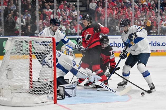 PRAGUE, CZECH REPUBLIC MAY 18 Connor Bedard of Canada and Ridly Greig of Canada battle in front of goalkeeper Harri Sateri of Finland during the preliminary round match between Canada and Finland at Prague Arena on May 18, 2024 in Prague, Czech Republic Prague Prague Arena Czech Republic Copyright: xJustPictures.ch AndreaxBrancax jp-en-EuSpIm-AB_18052024_AAB_3505