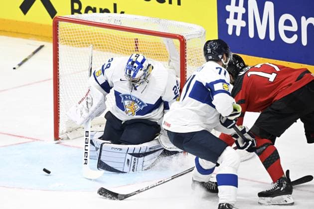 Goalkeeper Harri Säteri and Ahti Oksanen (71) of Finland and Jack McBain (R) of Canada during the 2024 IIHF Ice hockey, Eishockey World Championships preliminary round group A match between Canada and Finland in Prague on May 18, 2024. Prague Czechia LKFTJK20240518174558AOHQ  Copyright: xEmmixKorhonenx LKFTJK20240518174558AOHQ
