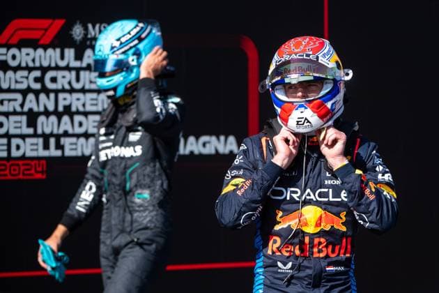 Max Verstappen Oracle Red Bull Racing, 01 celebrates pole position 1 at Parc Ferme, behind him George Russell Mercedes AMG Petronas Formula One Team, 63 , ITA, Formula 1 World Championship, Grand Prix Emilia Romagna Imola, Autodromo Enzo e Dino Ferrari, Qualifying, 18 05 2024 ITA, Formula 1 World Championship, Grand Prix Emilia Romagna Imola, Autodromo Enzo e Dino Ferrari, Qualifying, 18 05 2024 Imola Copyright: xEibner-Pressefoto Memmlerx EP_MMR