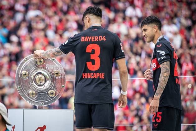 1 Soccer Bundesliga Bayer 04 Leverkusen FC Augsburg, 18 05 2024 Championship trophy with Piero Hincapie Bayer 04 Leverkusen, 3 and Exequiel Palacios Bayer 04 Leverkusen, 25 Leverkusen, 18 05 2024, 34 Matchday of 1 Soccer Bundesliga, 1 Soccer Bundesliga Bayer 04 Leverkusen FC Augsburg, BayArena, Leverkusen The DFL regulations prohibit the use of photographs as image sequences and or quasi videos Copyright: xBEAUTIFULxSPORTS LeahxKohringx