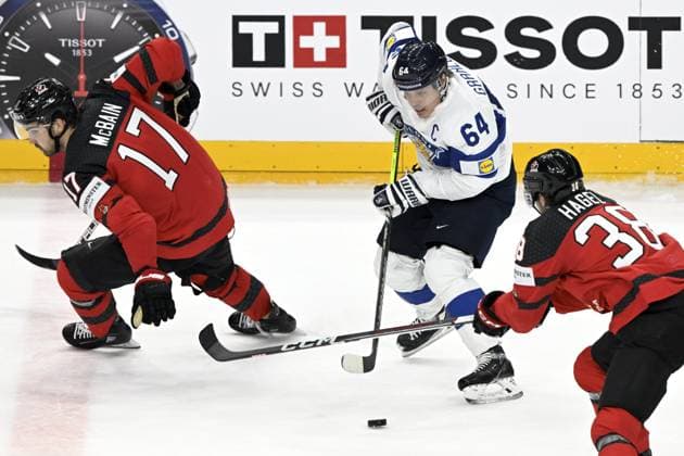 Jack McBain and Brandon Hagel (R) of Canada and Mikael Granlund of Finland during the 2024 IIHF Ice hockey, Eishockey World Championships preliminary round group A match between Canada and Finland in Prague on May 18, 2024. Prague Czechia LKFTJK20240518193915SFGR  Copyright: xEmmixKorhonenx LKFTJK20240518193915SFGR
