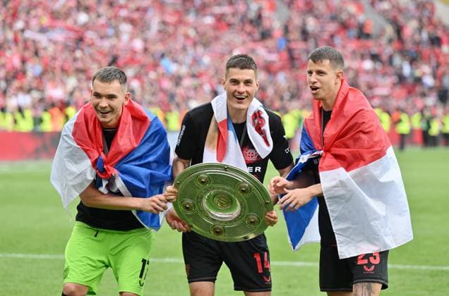 Goalkeeper Matej Kovar Bayer 04 Leverkusen , Patrik Schick Bayer 04 Leverkusen , Adam Hlozek Bayer 04 Leverkusen , from left , celebrate with the championship trophy 18 05 2024, Soccer season 2023 2024, 1 Bundesliga, Matchday 34, Bayer 04 Leverkusen FC Augsburg 2 1 Leverkusen BayArena Nordrhein Westfalen Germany Team2