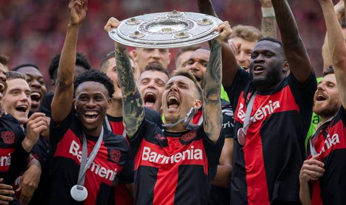 Leverkusen, Germany 18th May 2024 Alejandro Grimaldo Leverkusen with championship trophy, Nathan Tella Leverkusen Victor Boniface Leverkusen Bayer Leverkusen FC Augsburg 18 05 2024
