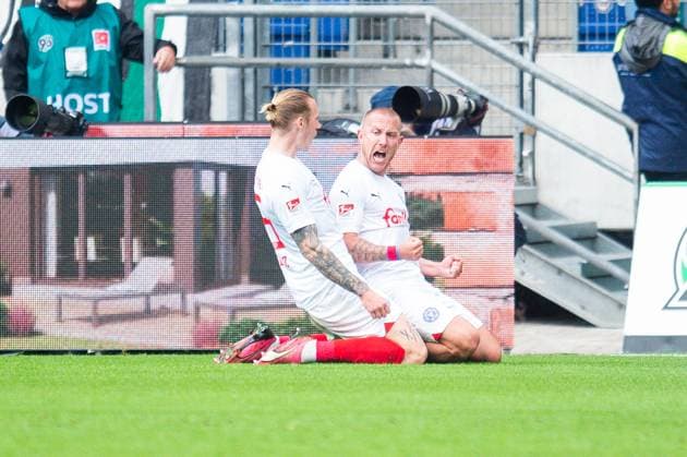 19 05 2024 Soccer, 2023 2024, 2 Bundesliga, Matchday 34, Hannover 96 Holstein Kiel R Lewis Holtby Kiel celebrates after his goal to 0 1 with L Marvin Schulz Kiel DFL REGULATIONS PROHIBIT ANY USE OF PHOTOGRAPHS AS IMAGE SEQUENCES AND OR QUASI VIDEO