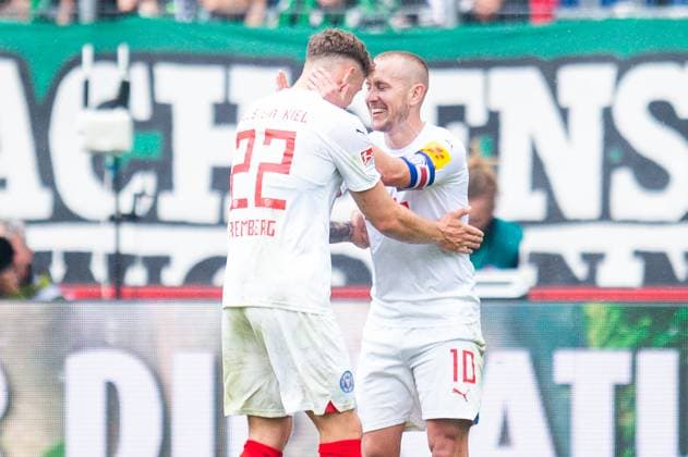 19 05 2024 Football, 2023 2024, 2 Bundesliga, Matchday 34, Hannover 96 Holstein Kiel R Lewis Holtby Kiel celebrates after his goal to 0 1 with L Nicolai Remberg Kiel DFL REGULATIONS PROHIBIT ANY USE OF PHOTOGRAPHS AS IMAGE SEQUENCES AND OR QUASI VIDEO