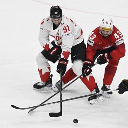 John Tavares of Canada, left, and Andrea Glauser of Switzerland in action during the 2024 IIHF World Championship, WM, Weltmeisterschaft group A match Switzerland vs Canada in Prague, Czech Republic, May 19, 2024. (CTKxPhoto VitxSimanek) CTKPhotoP2024051906600  CTKPhotoP2024051906600