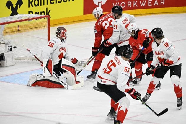 Goalkeeper of Canada Jordan Binnington, left, gives up a goal during the 2024 IIHF World Championship, WM, Weltmeisterschaft group A match Switzerland vs Canada in Prague, Czech Republic, May 19, 2024. From left Nino Niederreiter of Switzerland, Kaiden Guhle and Colton Parayko of Canada, Andres Ambuhl of Switzerland and Dawson Mercer of Canada. (CTKxPhoto VitxSimanek) CTKPhotoP2024051906902  CTKPhotoP2024051906902