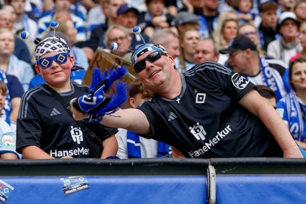 this HSV fan and his son were cheerfully crazy in a good mood and cheered Germany , Hamburg , Volksparkstadion , Soccer , Bundesliga , 2 Soccer Bundesliga , Hamburger SV 1 FC Nürnberg