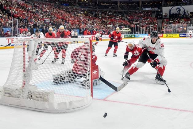 PRAGUE, CZECH REPUBLIC MAY 19 Owen Power of Canada in a battle for the puck against Sven Andrighetto of Switzerland andgoalkeeper Leonardo Genoni of Switzerland during the preliminary round match between Switzerland and Canada at Prague Arena on May 19, 2024 in Prague, Czech Republic Prague Prague Arena Czech Republic Copyright: xJustPictures.ch AndreaxBrancax jp-en-EuSpIm-AB_19052024_DSC_4448