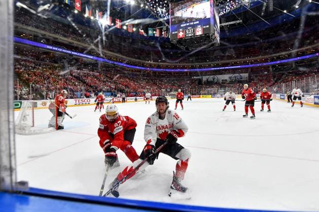 PRAGUE, CZECH REPUBLIC MAY 19 Jonas Siegenthaler of Switzerland in a battle along the boards against Dawson Mercer of Canada during the preliminary round match between Switzerland and Canada at Prague Arena on May 19, 2024 in Prague, Czech Republic Prague Prague Arena Czech Republic Copyright: xJustPictures.ch AndreaxBrancax jp-en-EuSpIm-AB_19052024_DSC_4477