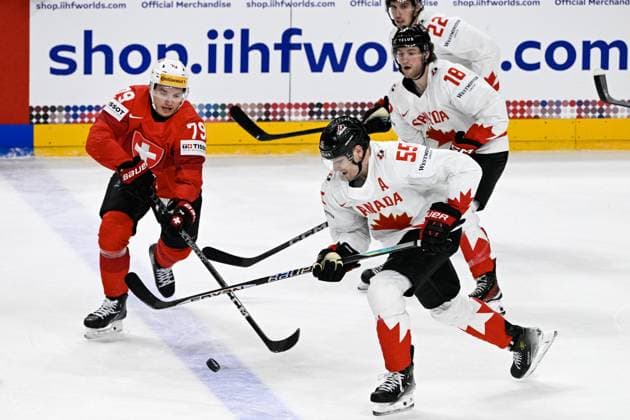 (L-R) Calvin Thurkauf of Switzerland, Colton Parayko, Dawson Mercer and Dylan Cozens of Canada in action during the 2024 IIHF World Championship, WM, Weltmeisterschaft group A match Switzerland vs Canada in Prague, Czech Republic, May 19, 2024. (CTKxPhoto VitxSimanek) CTKPhotoP2024051907369  CTKPhotoP2024051907369