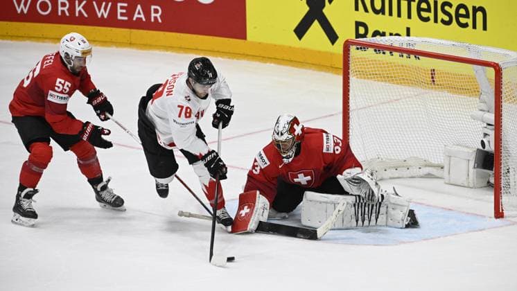 (L-R) Romain Loeffel of Switzerland, Damon Severson of Canada and goalkeeper of Switzerland Leonardo Genoni in action during the 2024 IIHF World Championship, WM, Weltmeisterschaft group A match Switzerland vs Canada in Prague, Czech Republic, May 19, 2024. (CTKxPhoto VitxSimanek) CTKPhotoP2024051907594  CTKPhotoP2024051907594