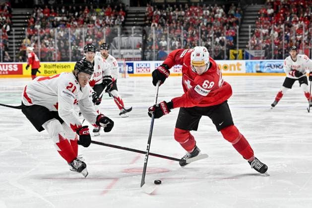 PRAGUE, CZECH REPUBLIC MAY 19 Fabrice Herzog of Switzerland in action against Kaiden Guhle during the preliminary round match between Switzerland and Canada at Prague Arena on May 19, 2024 in Prague Prague, Czech Republic Prague Prague Arena Czech Republic Copyright: xJustPictures.ch AndreaxBrancax jp-en-EuSpIm-AB_19052024_AAB_8960