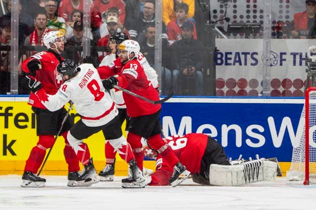 PRAGUE, CZECH REPUBLIC MAY 19 Nico Hischier of Switzerland 2nd from R defending goalkeeper Leonardo Genoni of Switzerland during the preliminary round match between Switzerland and Canada at Prague Arena on May 19, 2024 in Prague Prague, Czech Republic Prague Prague Arena Czech Republic Copyright: xJustPictures.ch JarixPestelaccix jp-en-EuSpIm-JP4_JAR_Switzerland_Canada_19May2024_199