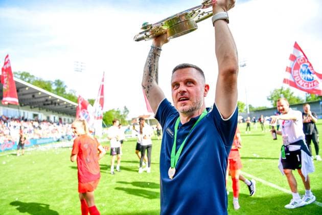 Alexander Straus coach Bayern with the championship trophy celebrates winning the German championship of the Google Pixel Womens Bundesliga 20023 2024 on 20 05 2024 Sinnsheim Dietmar Hopp Stadium Baden Württemberg Bavaria