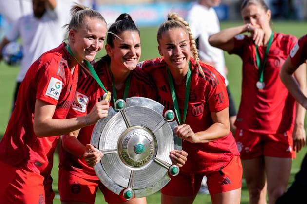 from left Lea Schüller FCB, 11 , Jovana Damnjanovic FCB, 9 and Giulia Gwinn FCB, 7 , player, players from FC Bayern Munich, cheering, at the award ceremony after the game with the championship trophy, with the trophy, honoring the German champion, after winning the championship, German champion 2023 24 in the Google Pixel Womens Bundesliga, joy about the victory, winner, winner, Winning the German Championship, German Champion, German Champion, rejoice, rejoicing, cheering, cheerful, joy, optimistic, positive, highlight, champions jubilation, action, 20 05 2024, Sinsheim Hoffenheim Germany , Football, Google Pixel Womens Bundesliga, TSG 1899 Hoffenheim FC Bayern Munich, DFB DFL REGULATIONS PROHIBIT ANY USE OF PHOTOGRAPHS AS IMAGE SEQUENCES AND OR QUASI VIDEO xozx