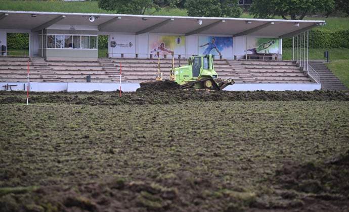 Football International EURO 2024 22 05 2024 The turf in the Hermann Saam Stadium in Freudenstadt will be renewed by the company Sportstaettenbau Garten Moser from Reutlingen around three weeks before the first training session of the Danish national team The old layer of turf will be removed with a bulldozer