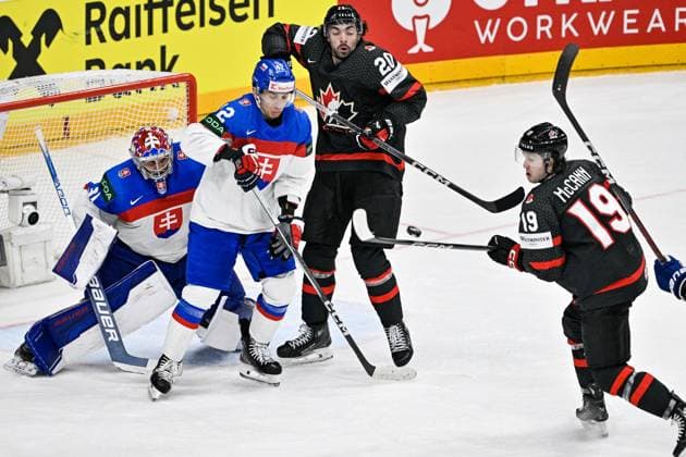 Canada vs Slovakia quarter-final match of the 2024 IIHF World Championship, WM, Weltmeisterschaft in Prague, Czech Republic, on May 23, 2024. L-R goalkeeper Samuel Hlavaj (SVK), Martin Fehervary (SVK), Dylan Cozens (CAN), Jared McCann (CAN). (CTKxPhoto VitxSimanek) CTKPhotoP2024052307376  CTKPhotoP2024052307376